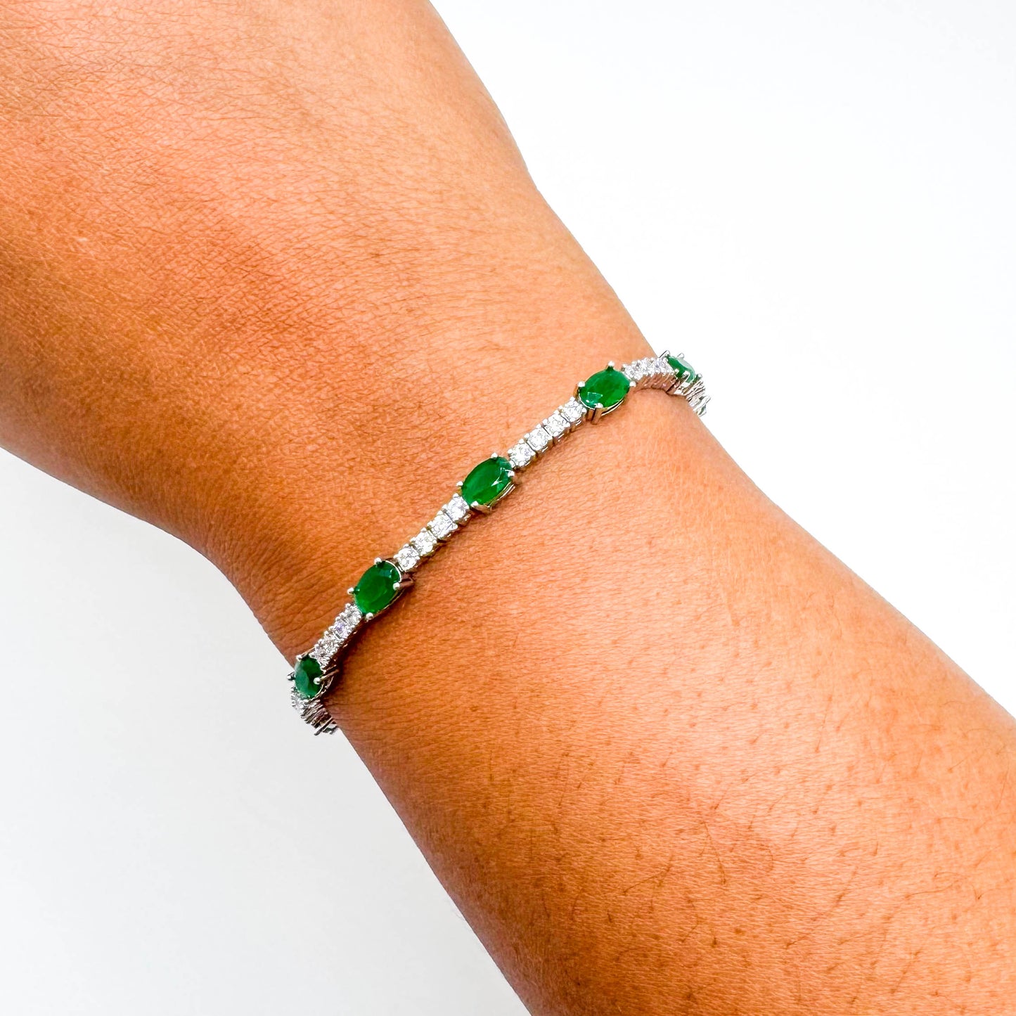 RHODIUM PLATED OVAL DIAMOND EMERALD BRACELET
